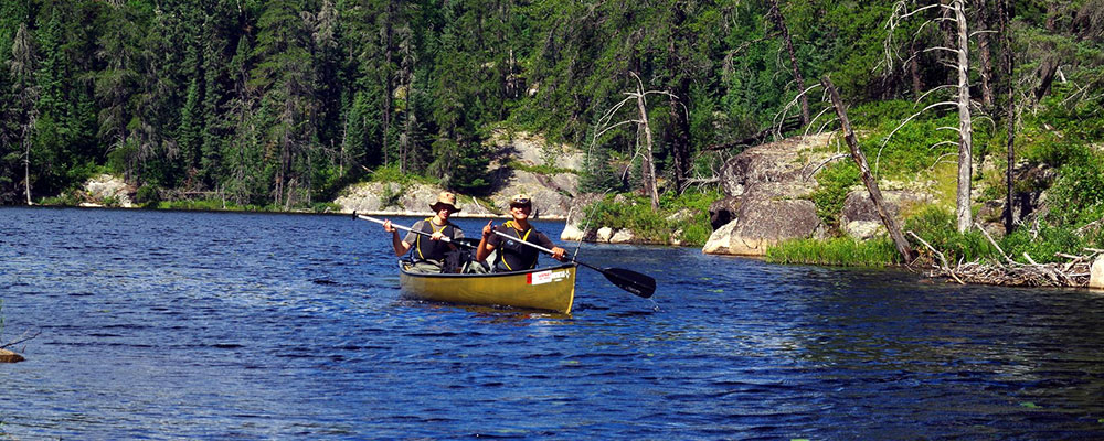Boys Canoeing on a River